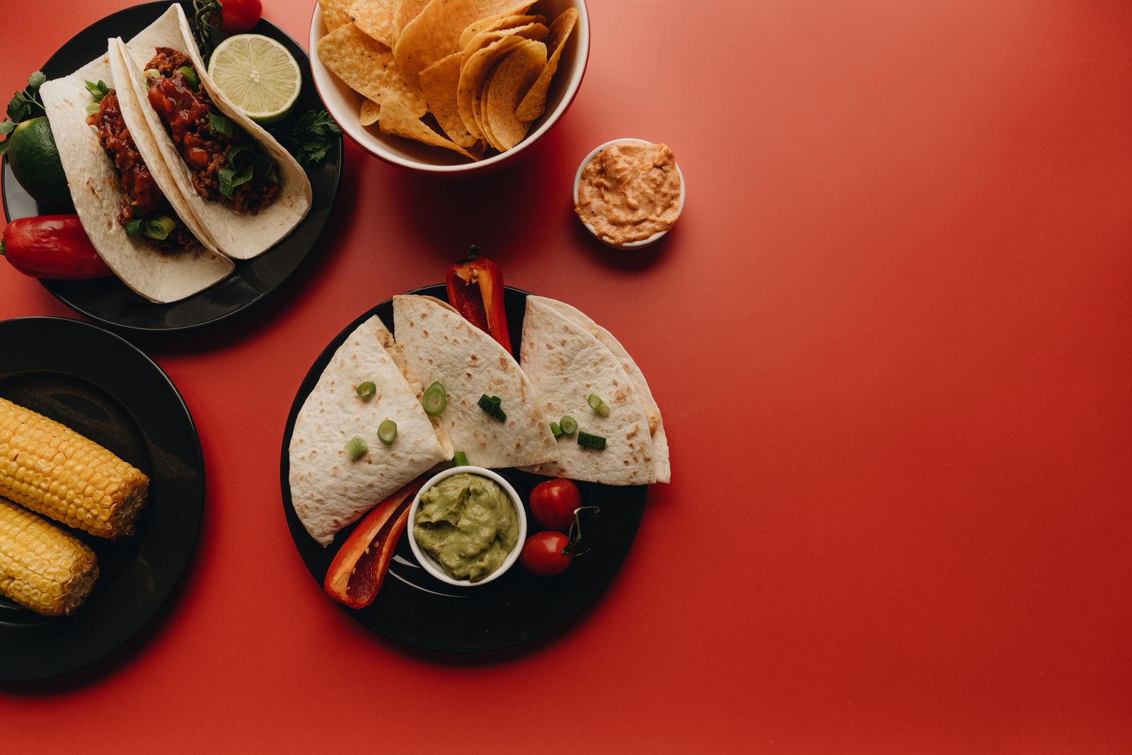 A spread of tacos and quesadillas, from above