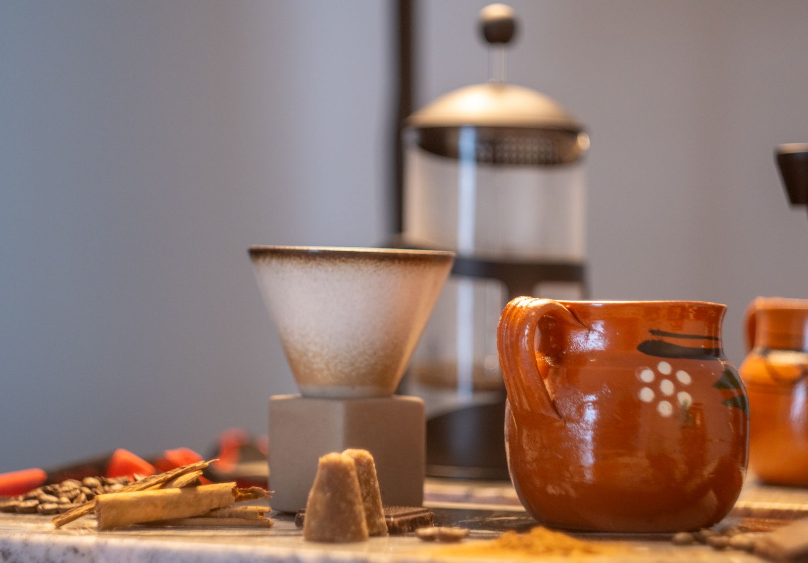 Café de olla in a clay jarrito